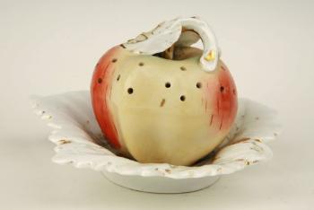 A porcelain apple on a plate A porcelain apple on a plate