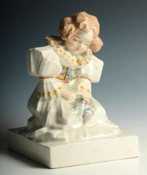 A kneeling female in national costume A kneeling female in national costume