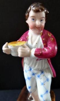 Barefoot boy with a bowl on a pedestal Barefoot boy with a bowl on a pedestal